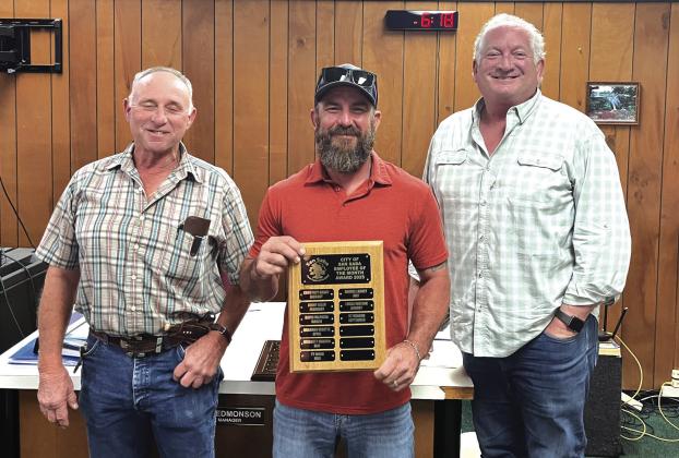 GT Meador (center) is Lead Man working in the Electric Department. He was selected as the Employee of the Month for September. His supervisor, Denver Daniel (left), and Alderman Shawn Oliver (right) presented GT with a plaque with his name on it and a gift certificate to a local restaurant. Photo courtesy of Scott Glaze