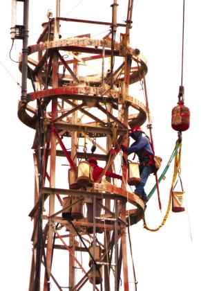 Company upgrades equipment for better services. “It's a long way to the top if you want to Rock and Roll. Workers are seen making modifications to communications tower,” said Chino Z. Photos Courtesy of Chino Z.