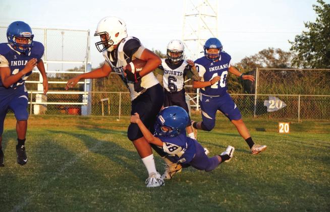 Cherokee Junior High’s Robert Sawyer attempting the tackle with Carlos Preciado and Uriah Valdez coming in to help during last Thursday night’s game. Photo by Valerie Valdez