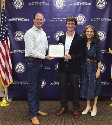 Jefferson Stencil, along with Amy Stencil (his proud mom), is shown here with Congressman August Pfluger who is honoring him at the Meet-and-Greet in San Angelo.
