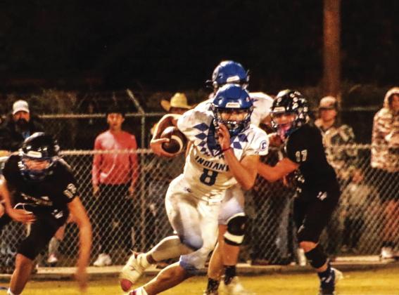 Cherokee’s Joel Valdez darts through the Coyote defense Courtesy of Sixmania football
