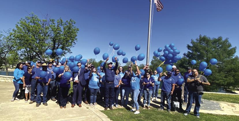 Blue balloons take flight to raise awareness against child abuse