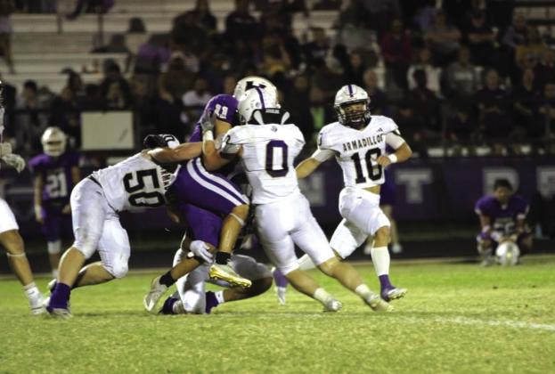 Team tackle from Pierce (#50) and Everett (#0). Courtesy of Kayti Lackey
