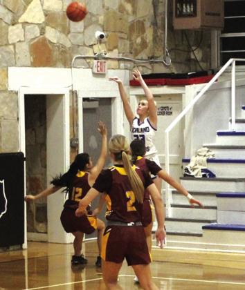 Maggie Bryant #23 jumps high over her opponents in last Friday’s win over Lometa, 70-19.