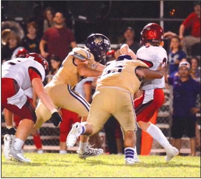 Jesus Gonzalez (55) and Jefferson Stencil putting pressure on the QB