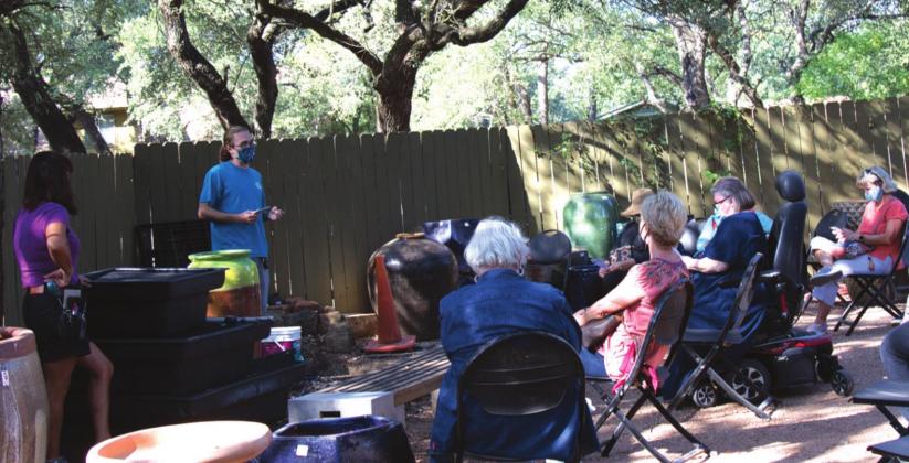 Members practice social distancing at mini-seminar on in-ground fountains.