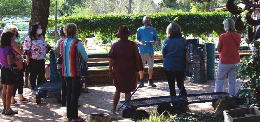 Members practice social distancing at mini-seminar on in-ground fountains.