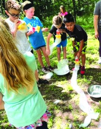 Pictured above: In the Kamp’s Recycling Fun class, children made a toy of recycled materials to create a bubble snake.