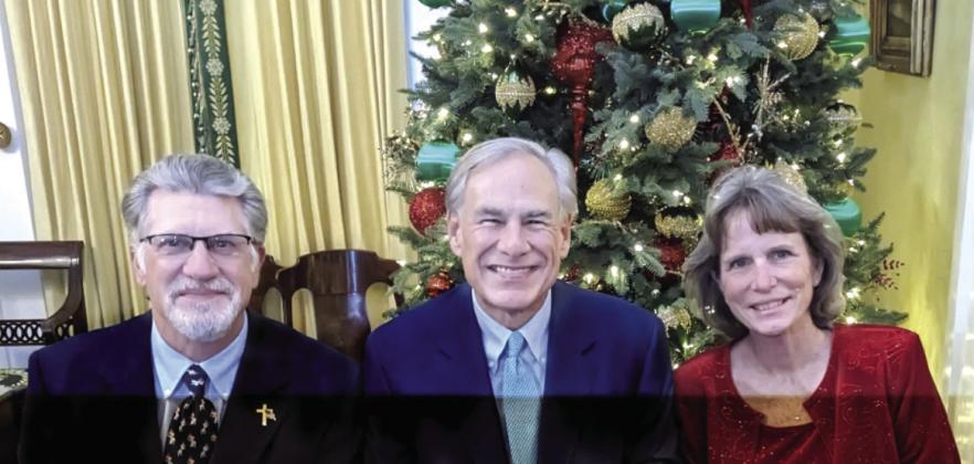 Jeffrey F. Carlson and his wife, Jacqueline, with Governor Greg Abbott