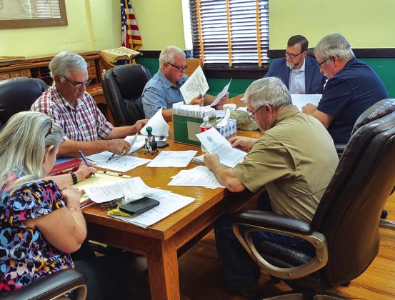 The Commissioners meet at least twice a month conducting business for San Saba County. They are seen here in the photo before the July 9th meeting pouring over their packets for the meeting. Pictured (going clockwise around the table from the left): County Clerk Kim Wells, Com. Kenley Kroll (Pct. 3), Com. Greg McGregor (Pct. 4), Judge Jody Fauley, Com. Mike Poe (Pct. 2), and Com. James Lebow (Pct. 1).