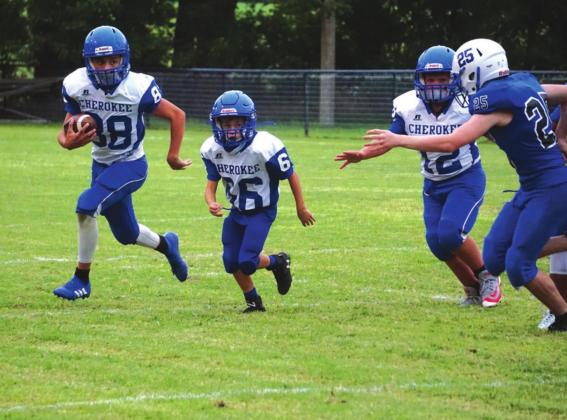 Joel Valdez, Weston Woolsey and Tatum Shanklin in the Junior High football game last week