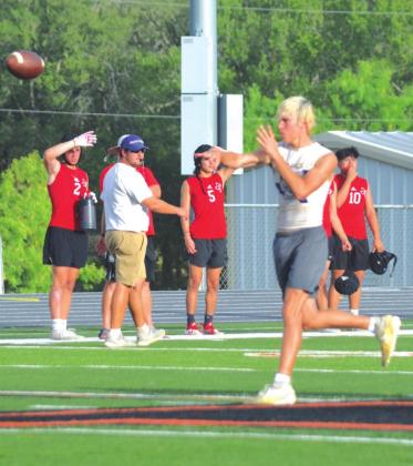 San Saba High School varsity football senior quarterback Lance Taylor zips a pass downfield to an open receiver on Wednesday, June 15, during a Dillos 7-on-7 summer scrimmage held at Llano High School.