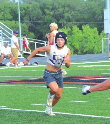 San Saba High School varsity football sophomore wide receiver Winton Lackey runs a crossing route on Wednesday, June 15th, during a Dillos 7-on-7 summer scrimmage held at Llano High School.