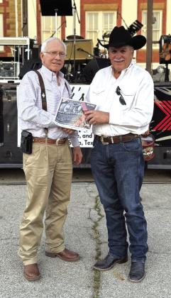 Lynn Hamrick presented Darwin Lewis with a gift certificate ($1,300 limit) for a set of tires. This prize was donated by Yokahoma. Courtesy of Hamrick’s Automotive Center