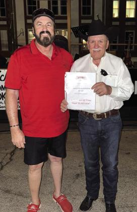 Lynn Hamrick presented Kenny Crawford from Lampasas a gift certificate ($1,300 limit) for a set of tires. This prize was donated by Gateway. Courtesy of Hamrick’s Automotive Center
