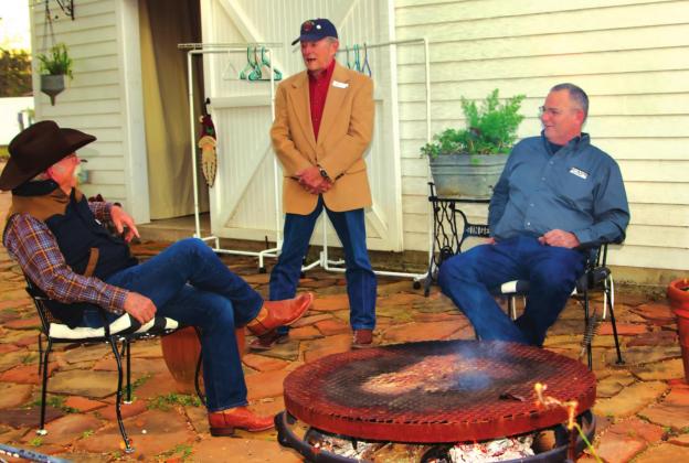 Husbands (l to r) John Sloan, Bill Furlan, and Walter Engman took advantage of the beautiful weather by sitting around the firepit on the Killion patio.