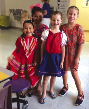 San Saba Elementary School students (front) Ailany Rodrigues and Allison Millican, and (back) Analia Aragon and Hadleigh Soto were so happy to show off their dresses for the occasion.