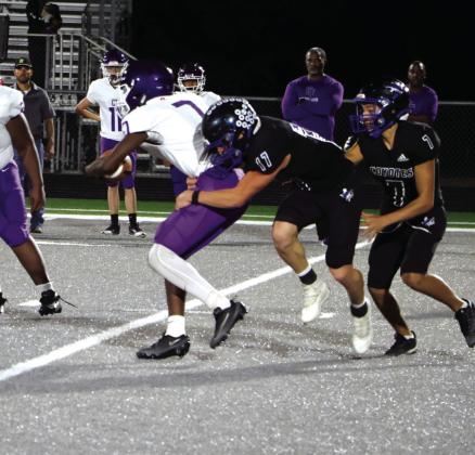 Photo by Pam Starr Coyotes defense - # 17 - Billy Perry; and #7- Trendon Vogel