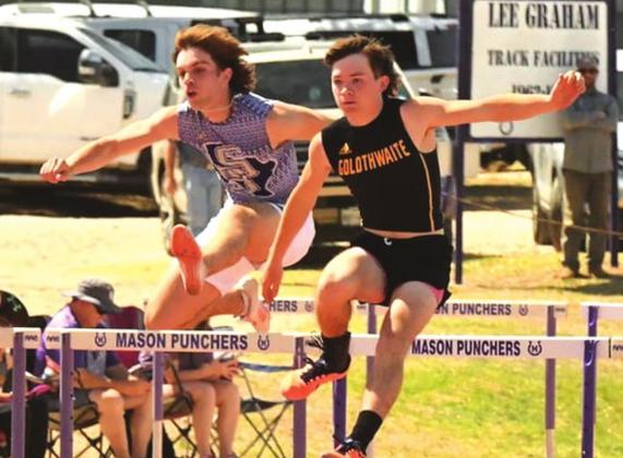 San Saba High School boys varsity track and field athlete Lance Taylor (left) clears a hurdle on Friday, April 8th, during the 110-meter hurdles event at the District 29-2A meet hosted by Mason High School. (Photo by Rita Boultinghouse)