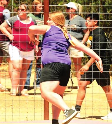 San Saba High School girls varsity track and field athlete Austyn Graham winds up her throw on Friday, April 8th, during the discus event at the District 29-2A meet hosted by Mason High School. (Photo by Rita Boultinghouse)