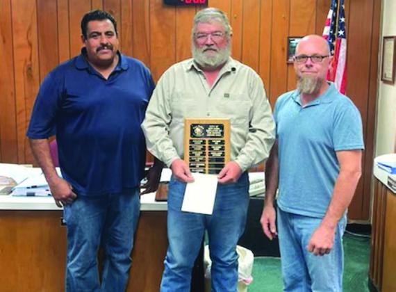 Pictured left to right are Street Department Supervisor Luis Rios, Street Department Employee Darrel Lackey (Employee of the month for September), and Alderman Michael Nelson. Photo by Chief John Bauer