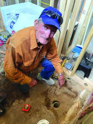 Jim Crook working on plumbing
