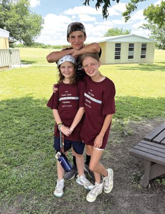 Valerie Valdez took this photo of the three kids at Heart of Texas Bible Camp in Brady. Ann Elise and Emily are in the front, Tilden is in the back.