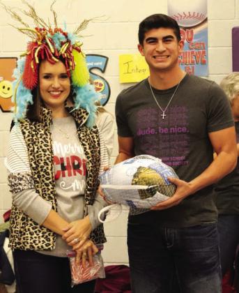 Pictured at right: The winner of the Elementary campus 'Turkey of the Year' Food Drive was Kallie Bush - The turkey and crown were presented by Noah Martinez. - Photo by Abagail Meador