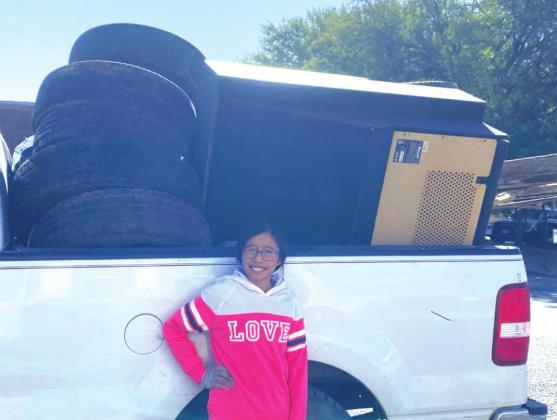 Evelyn showing trash collected.