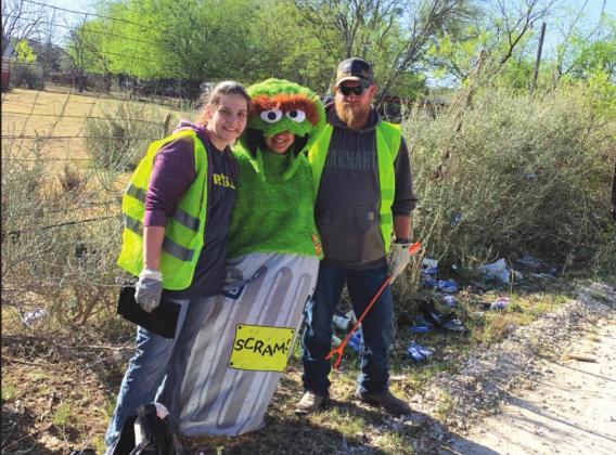 Volunteers picking up litter.