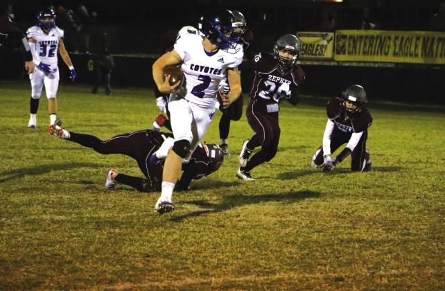 #2 Keston Lusty carries the ball past the Bulldog defense.