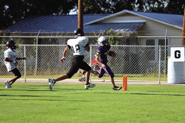 #3 Brian Rocha takes the ball into the end zone for a touchdown last Thursday evening.