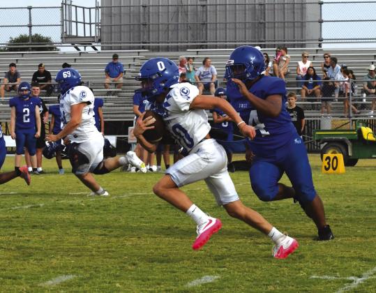 Weston Woolsey running the ball in the scrimmage against Covington Photo courtesy Valerie Valdez