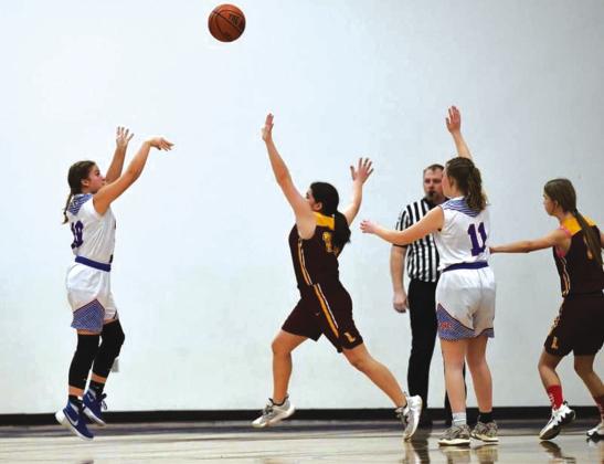 Lily Graves takes a shot in the junior high game against Lometa. Courtesy of Rita Boultinghouse