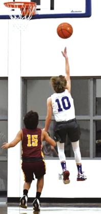 Weston Woolsey goes in for the layup in the junior high game against Lometa. Courtesy of Rita Boultinghouse