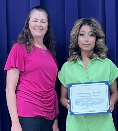 Carol Cunningham from Congressman August Pfluger’s office with Regional Art Winner Kelyn Yanez. | Photo by Shara Wright | TAEA Region 15 Representative