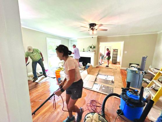 These wonderful volunteers are cleaning the floors and decorating on Saturday. Photo courtesy of Corina Fauley