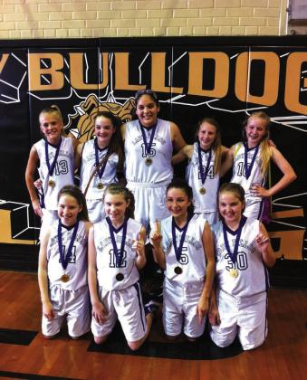 2013 JLD still holds program records for longest winning streak at 34 games, most tournament championships in a season at 14, most tournament championships in a row at 11, and most 3 pointers in a game at 8. Pictured left to right, kneeling, are: Savannah Johnson, Hannah Osbourne, Bailee Franks, and Kira Moore. Standing left to right are: Casey Mathis, Brenna Chambers, Kirsten Jimenez, Ashlynn Cash, and Linzey Maxcey. Courtesy of Oscar Zepeda