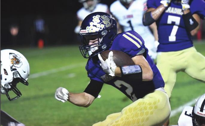 San Saba High School varsity football junior wide receiver, Tyler Johnson (2), attempts to break tackles on Friday, September 17th, during the Dillos’ 48-18 loss to Llano High School at Rogan Field.
