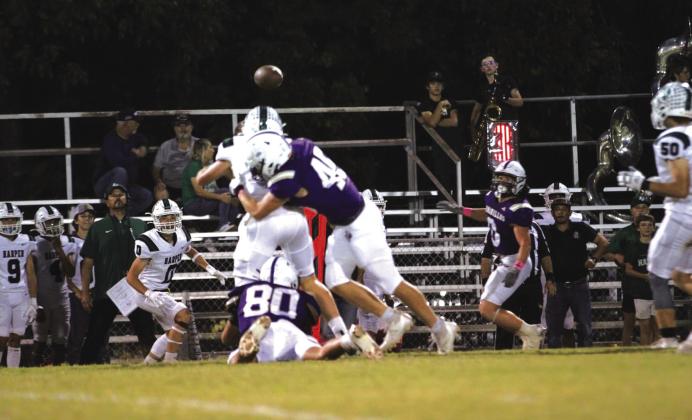 Adrian Martinez (80) and Jefferson Stencil (45) putting pressure on Harper’s quarterback. Courtesy of Kayti Lackey – 1916 athletics