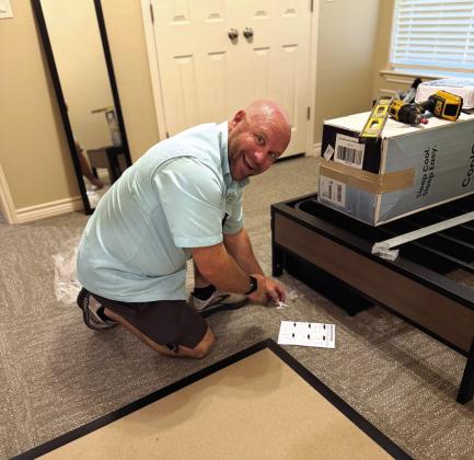 Ryan assembling a bed