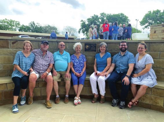The family of Stan Weik pose near the commemorative plaque on the horseshoe bench in Mill Pond Park in memory and honor of their loved one, Stan, who served as San Saba’s City Manager for 13 years. He was instrumental in developing and guiding many beautification projects in San Saba. The dedication and memorial ceremony took place Friday, April 22nd, and was well attended by the community. (Photo provided by Sarah Saldivar)