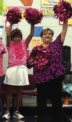 Dora Miller and Donna Shahan lead the SSES Students in a ”Beat Cancer” Cheer! Courtesy of Dani Gilcrease
