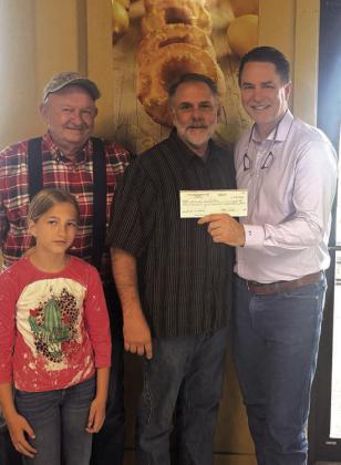 Meals on Wheels donation check for $1,500.00. Pictured L-R are Pearl Gunter (front), Tommy Pulatie, Joe Johnson, and Marcus Wood. Courtesy of Marcus Wood