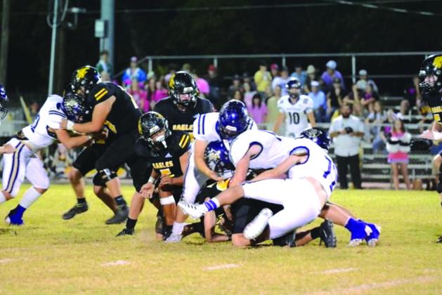The Dillo defense making a team tackle stopping the Eagles last Friday night. Courtesy of Rita Boultinghouse