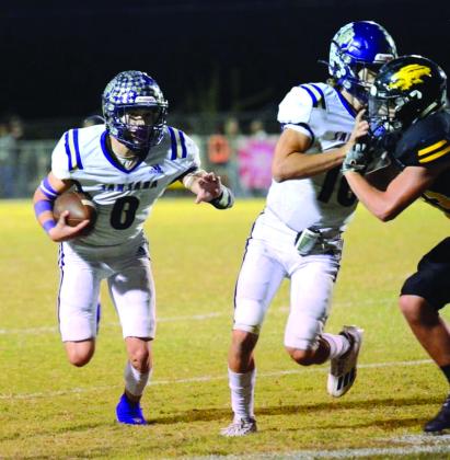 Ethan Gonzales picks up a block from Miller and heads to the end zone. Courtesy of Rita Boultinghouse