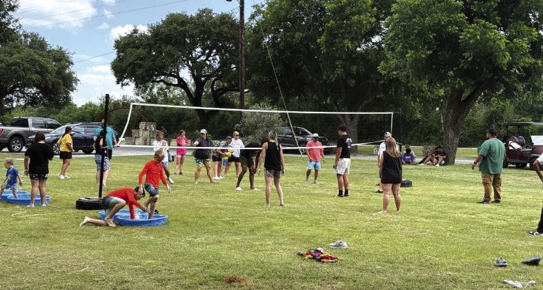 Family Day- Cherokee Home staff and kids enjoying volleyball on the lawn.
