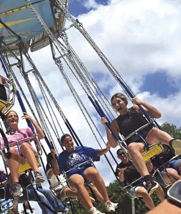 Theresa McKenna, Susan and Mae enjoying the rides at Sea World Photos courtesy of Cherokee Home for Children