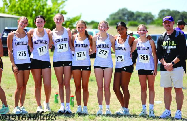 Lady Dillo varsity girls Cross Country team before their race in Goldthwaite last Wednesday - L-R: Caitlin Mays, Raylee Wood, Landry Eudy, Sydni Jones, Leslie Olalde-Yanez, Hailey Gilliam, and Coach McKethan