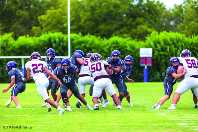 JV linemen making blocks